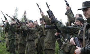 Combatants fire their weapons in honour of Aleksey Mozgovoi, a militant leader of the separatist self-proclaimed Luhansk People's Republic, during the funeral of Mozgovoi and his subordinates in the town of Alchevsk in Luhansk region, Ukraine, May 27, 2015. Mozgovoi, a top rebel commander in east Ukraine, was killed along with around six others in an attack by an unknown group of assailants, the press service for the separatist Luhansk territory (LITs) reported on May 23. REUTERS/Alexander Ermochenko